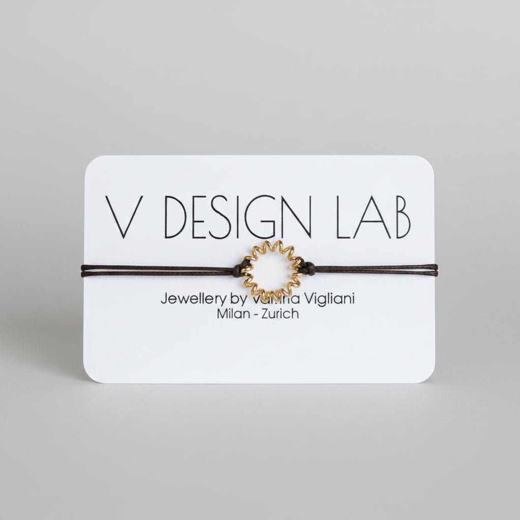 Brown bracelet with Spira Molla circular design on a 'V Design Lab' 