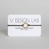 Brown bracelet with Spira Molla circular design on a 'V Design Lab' 