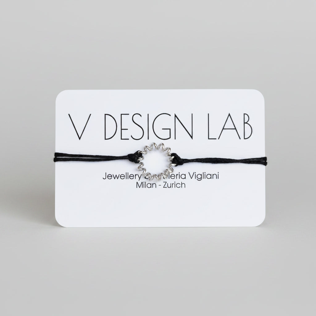 Black bracelet with Spira Molla circular design on a 'V Design Lab' 