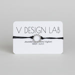 Black bracelet with Spira Molla circular design on a 'V Design Lab' 