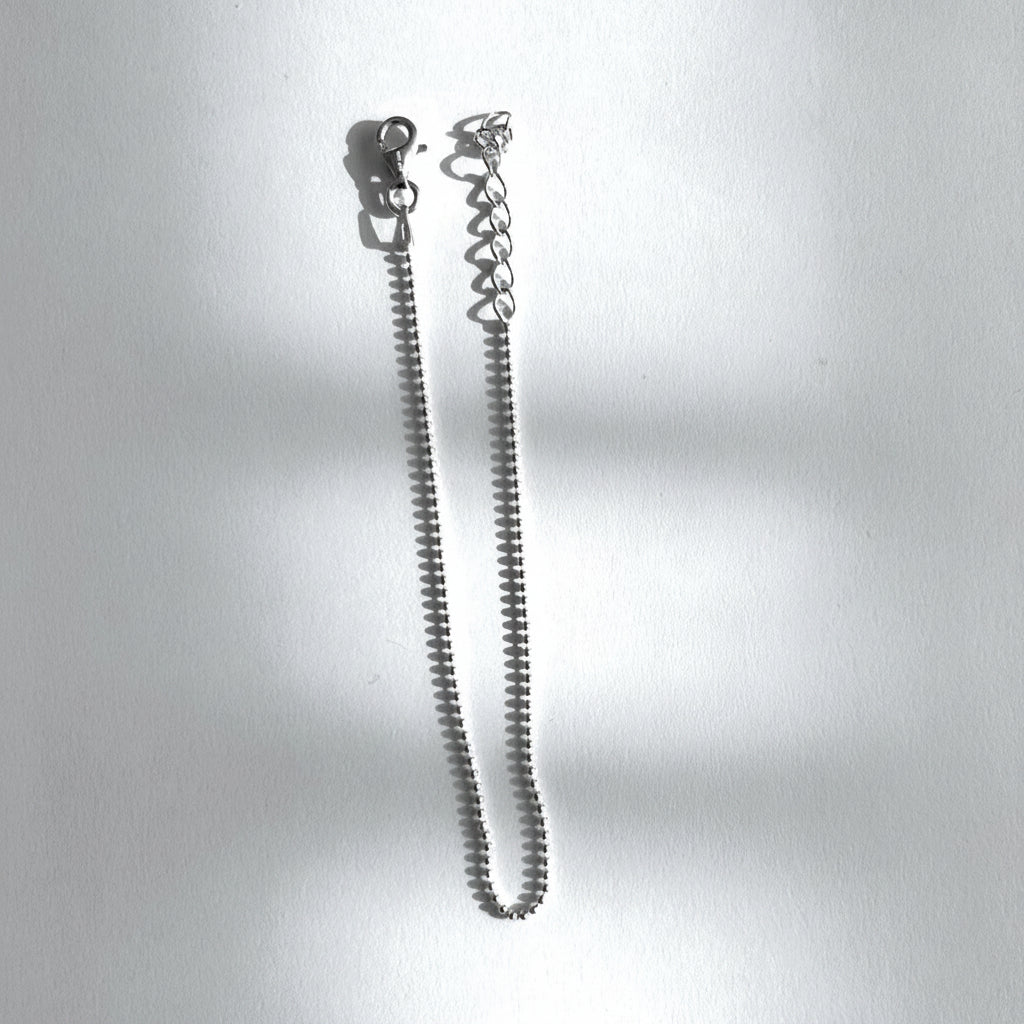 A silver bracelet with a mini sphere design v Design Lab