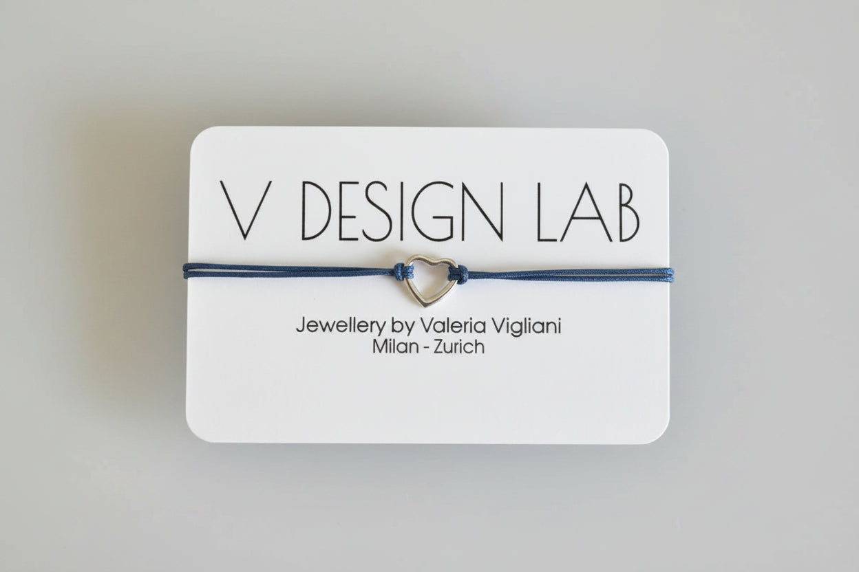 Bracelet with heart charm on a V Design Lab card 