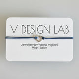Bracelet with heart charm on a V Design Lab card 